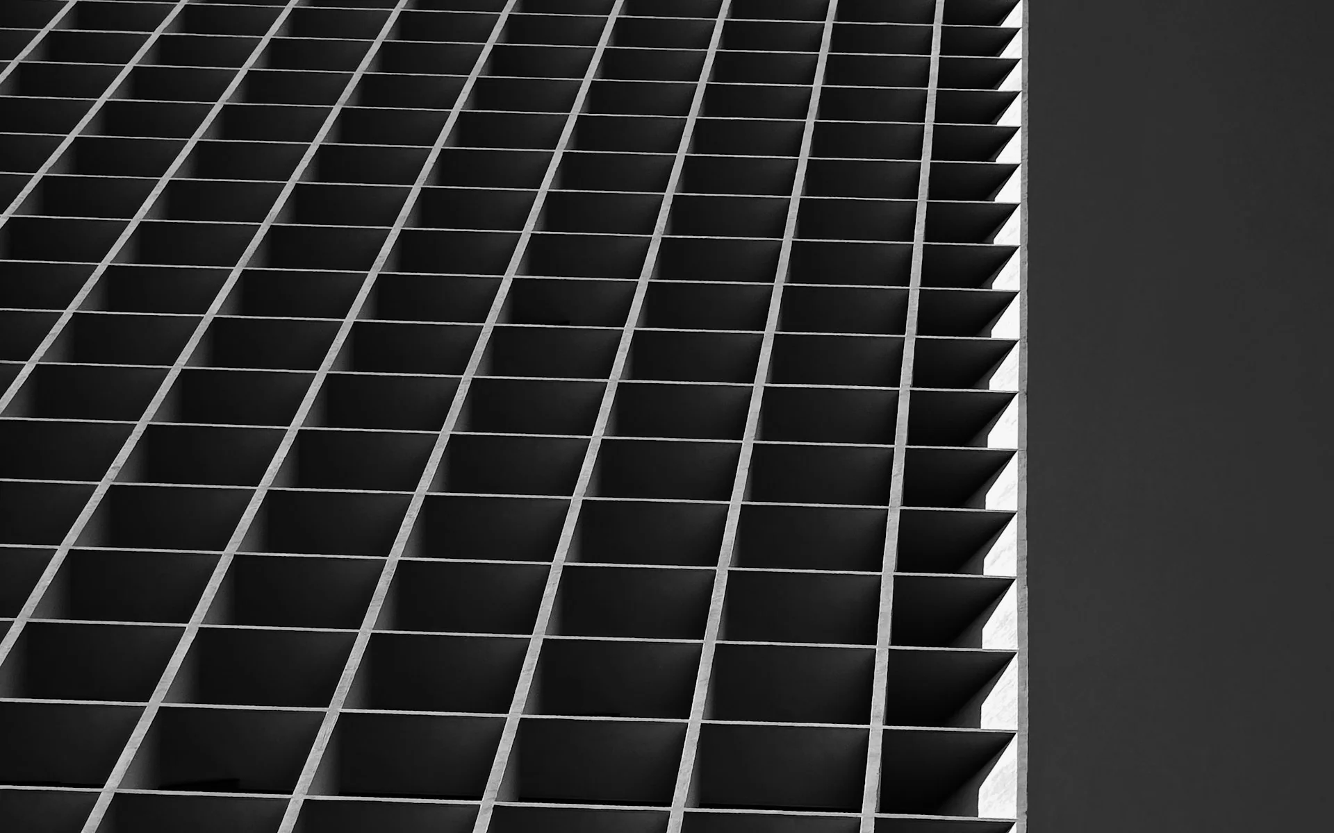 Geometric architectural surface with sharp diagonal shadow lines